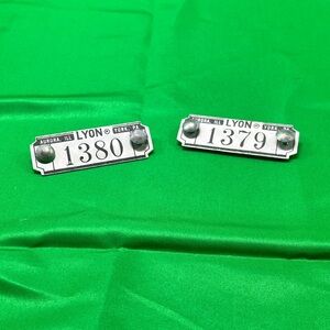 Vintage industrial metal locker number tags or plates from Lyon Metal Products